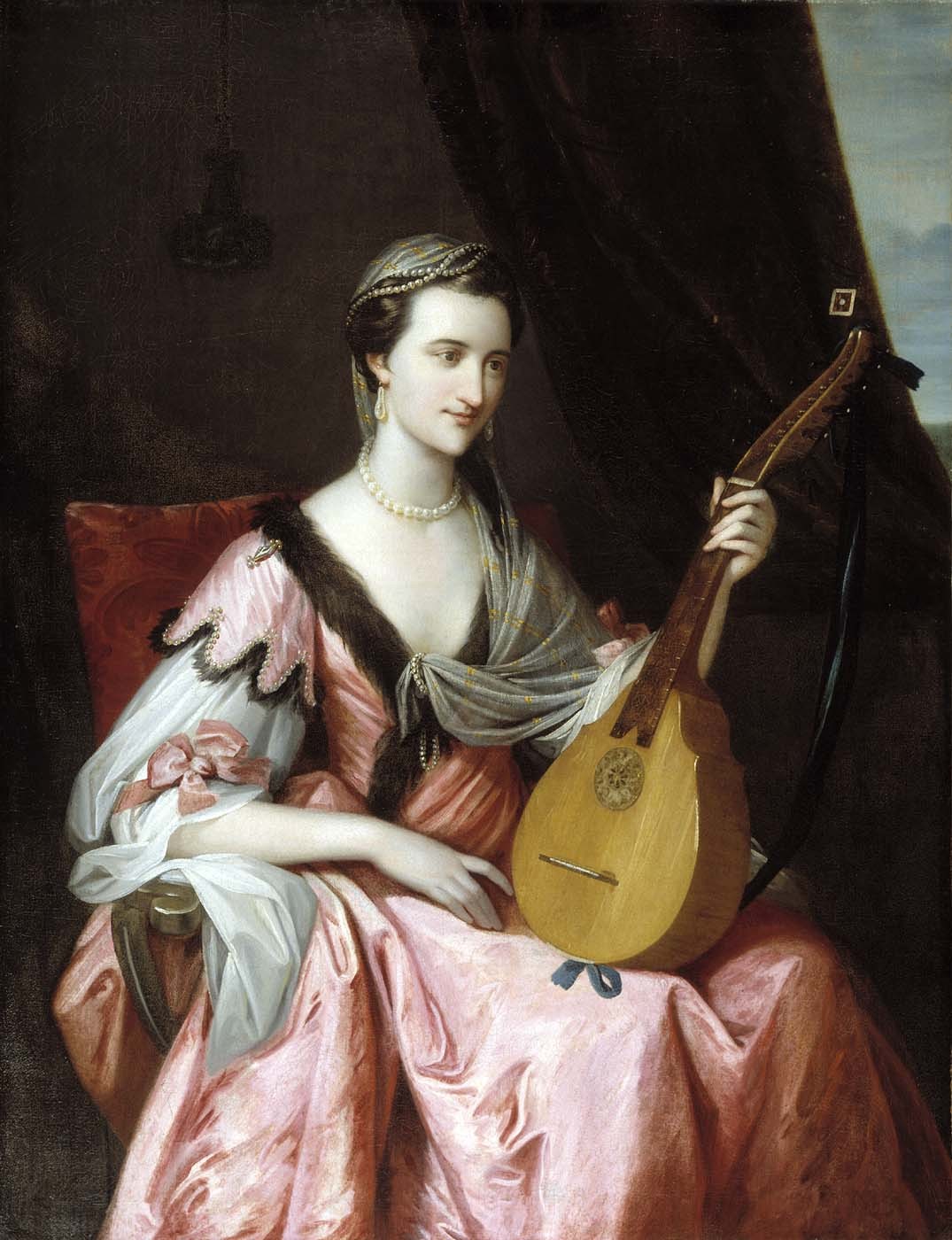Mary Hopkinson (c.1764). Benjamin West (American, 1738-1820). Oil on canvas. Smithsonian American Art Museum.
Mary Hopkinson was the wife of Dr. John Morgan, chief surgeon of the Continental army and founder of the Penn Medical School. West painted from a miniature of Mary brought to London. The mandolin was a fashionable instrument for aristocratic ladies. She wears a lavish pink satin gown with a sable collar and pearls. This outfit was not typical dress for colonial women, but was invented by West to conjure 18th-century European tastes for all things related to the Orient.