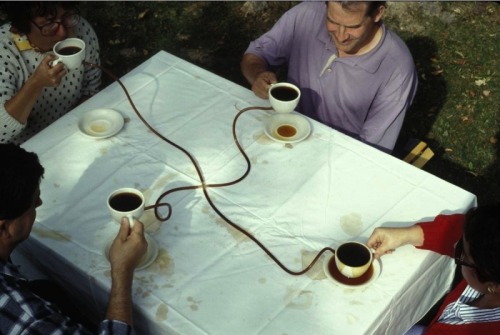 colinquinn:Allan Wexler.
Coffee Seeks Its Own Level. 1990. If one person alone lifts his cup, coffee overflows the other three cups. All four people need to coordinate their actions and lift simultaneously. Inspired by the principle “water seeks its own level”. I had been working on a series of projects using basic scientific principles learned in high school as a means to explore architectural issues.    
