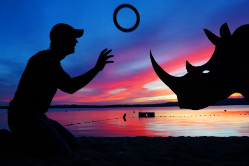 tastefullyoffensive:

Sunset Selfies by John Marshall  “This collection started while I spent some time living in a small cabin on Frye Island, Maine. After watching gorgeous sunsets right out my back door, I decided to start a creative project I’m calling Sunset Selfies. When I’m on the island, I make one cardboard cutout each night and take a silhouette picture with it.”Here’s a video of John explaining how he makes the cutouts.