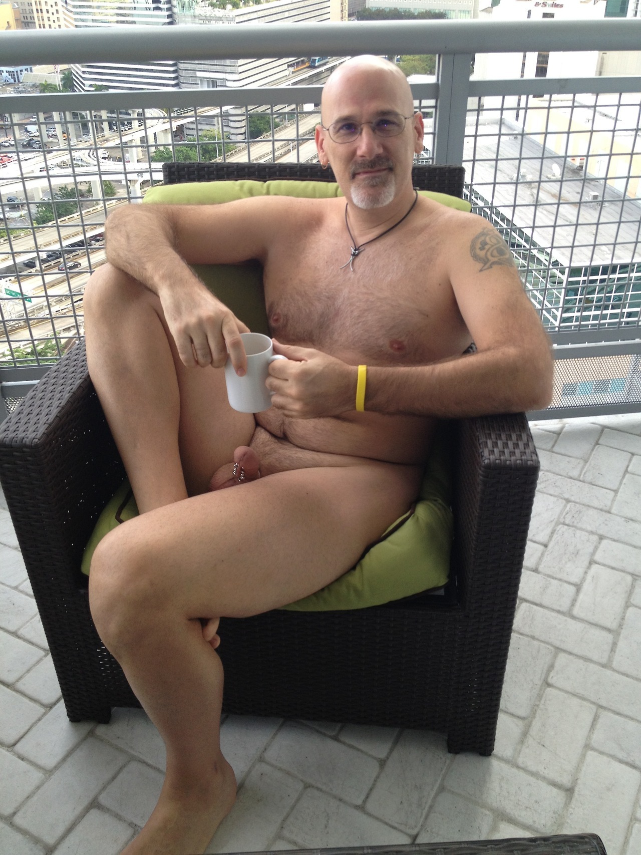Lounging with coffee on a balcony.
