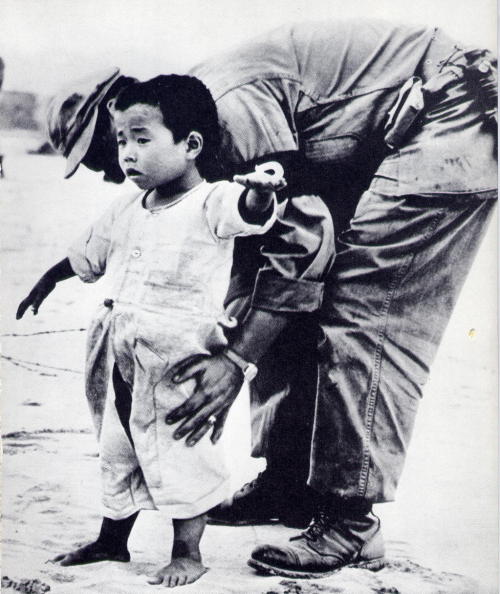 Unknown AP photographer, Korean Refugee Child being searched for Weapon
Children of Many Lands
