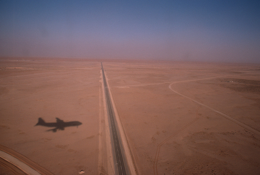 The shadow of an aircraft over the Saudi desert, November 1986.Photograph by Jodi Cobb, National Geographic Creative