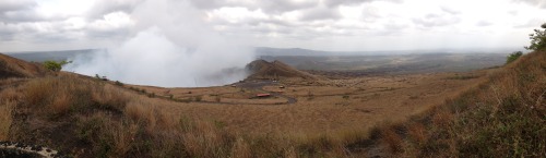 A view from the top of the Masaya Volcano, which is an active volcano located just outside of Managua. The photo is overlooking one of the giant craters from which sulphuric acid is rising from.