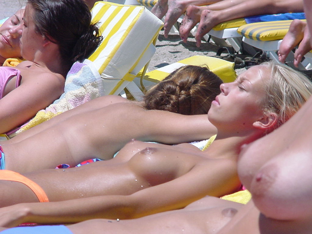 Puffy nipple girl topless beach